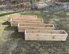 Load image into Gallery viewer, Set of wooden planters on a grassy ground