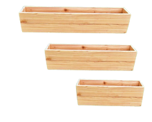 Load image into Gallery viewer, Three wooden planters of different sizes on a white background